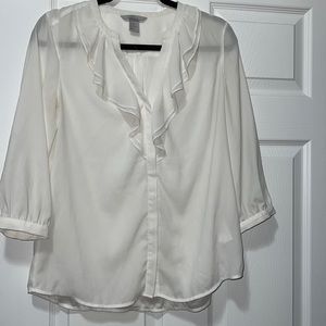 White ruffled blouse